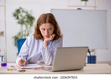 Young Female Chemist Working At The Lab