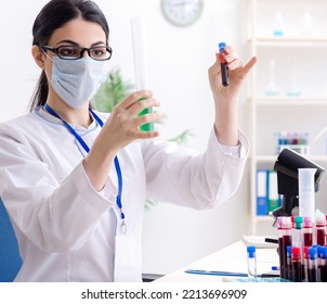 Young Female Chemist Working In The Lab