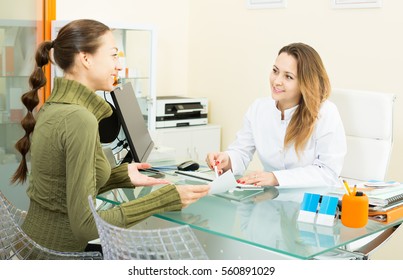 Young Female Client Visiting Consultation In Aesthetic Medicine Center. Focus On Doctor 