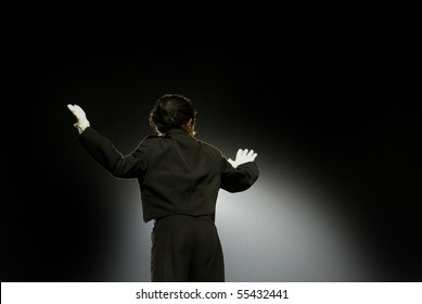 Young Female Conductor Of A College Marching Band.