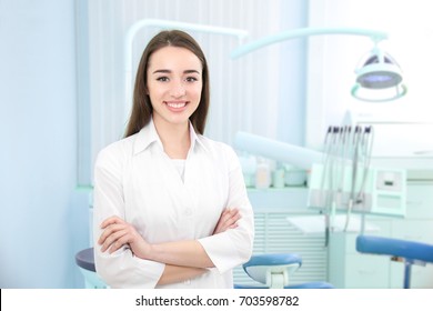 Young Female Dentist Light Office