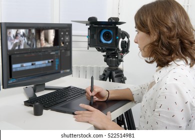 young female designer using graphics tablet for video editing - Shutterstock ID 522514981