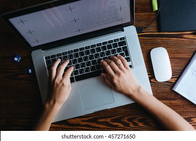 Young Female Designer Working On Computer. Top View