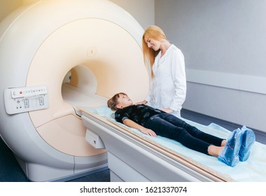 Young Female Doctor And Child In MRI Room 