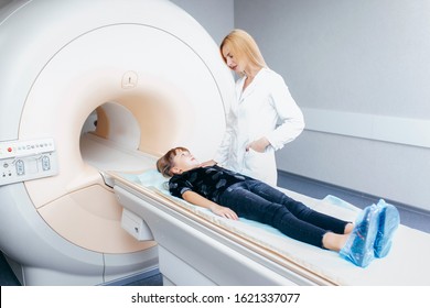 Young Female Doctor And Child In MRI Room 