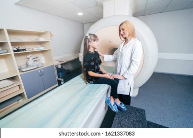 Young Female Doctor And Child In MRI Room 