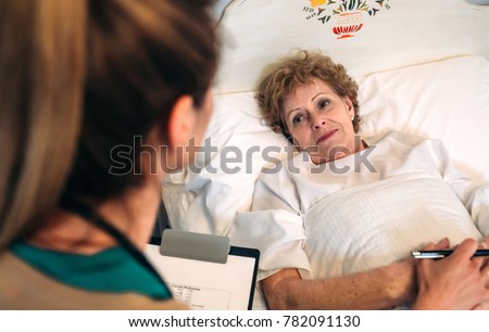 Similar – Female doctor comforting older female patient