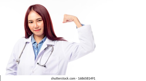 Young Female Doctor Flexing Her Arms Acting Like A Superhero. Medical Woman Doctor Ready To Cure Patient. She Get Strong And Ready For Working Hard. She Wear White Coat. Copy Space, White Background