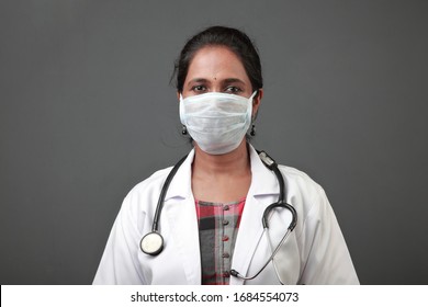 Young Female Doctor Of Indian Origin Wearing Face Mask