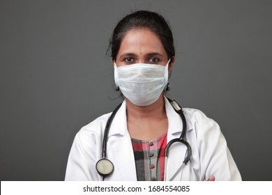 Young Female Doctor Of Indian Origin Wearing Face Mask