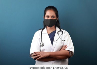 Young Female Doctor Of Indian Origin Wearing Face Mask