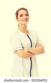 Young Female Doctor Or Nurse With Folded Arms.