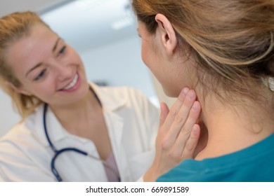 young female doctor with female patient - Shutterstock ID 669891589