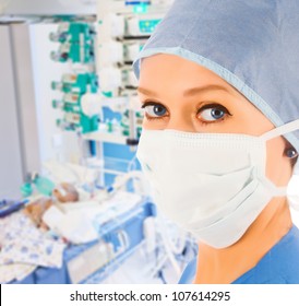 Young Female Doctor In Pediatric Intensive Care Unit