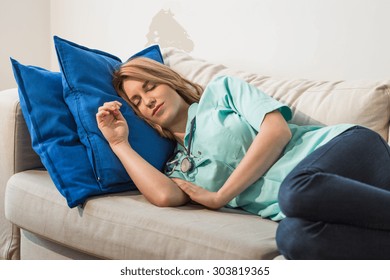 Young Female Doctor Sleeping During Night Shift