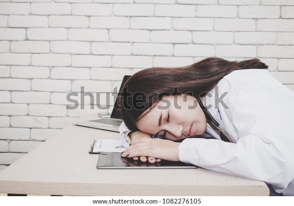 Young Female Doctor Sleeping Her Desk Stock Photo Edit Now