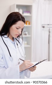 Young Female Doctor Taking Notes