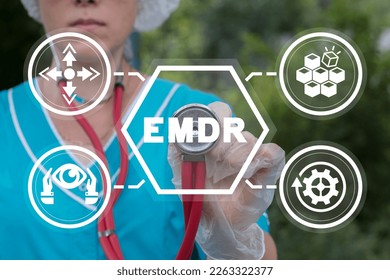 Young female doctor using virtual touchscreen touches abbreviation: EMDR. Concept of EMDR Eye Movement Desensitization Reprocessing. EMDR medical therapy. - Shutterstock ID 2263322377