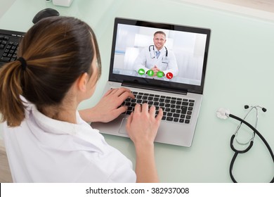 Young Female Doctor Video Chatting On Laptop In Clinic - Powered by Shutterstock