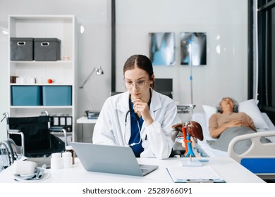 Young female doctor in white medical uniform using laptop and tablet talking video conference call at desk,Doctor sitting at desk and writing a prescription for her patient in hospital
 - Powered by Shutterstock