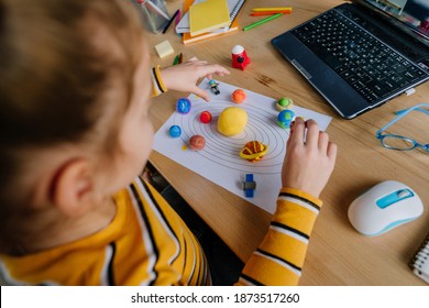 Young Female Elementary School Student Watching Astronomy Lesson Online