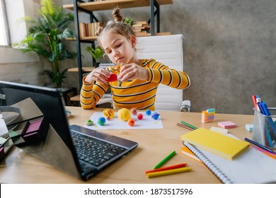 Young Female Elementary School Student Watching Astronomy Lesson Online