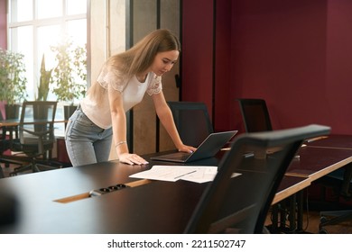 Young Female Employee Involved In Office Work