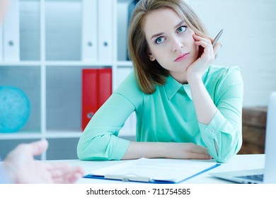 Young Female Employee Of The Staffing Agency Listening Bored The Male Job Seeker.