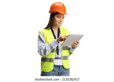 Young female engineer with a safety vest and helmet using a tablet isolated on white background - Powered by Shutterstock