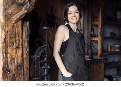 A young female entrepreneur has a small business in the production of metal craft products - Powered by Shutterstock