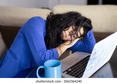 young female executive dressed in blue asleep at home during telework time due to exhaustion from blue Monday. - Shutterstock ID 2062364240