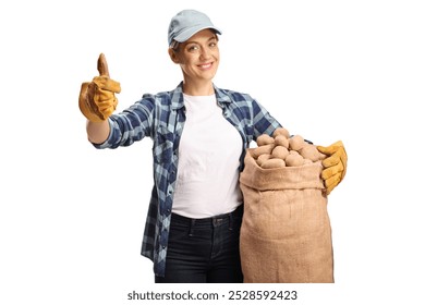 Young female farmer holding potatoes in a sack and gesturing thumbs up isolated on white background - Powered by Shutterstock