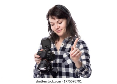 Young Female Freelance Professional Photographer Or Art Student Or Photojournalist On A White Background Holding A Camera Telling Client To Stop