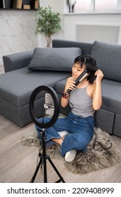 Young Female Hairstylist Recording Her Hairstyle Tutorial Video