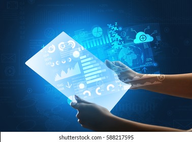 Young female hand holding a tablet with blue graphs  - Shutterstock ID 588217595