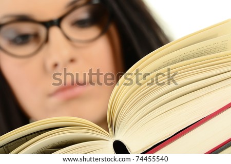 Young female holding an open book. Woman reading.