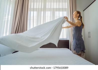 Young Female Housekeeper Changing Bedding In Hotel Room - Shutterstock ID 1795610089