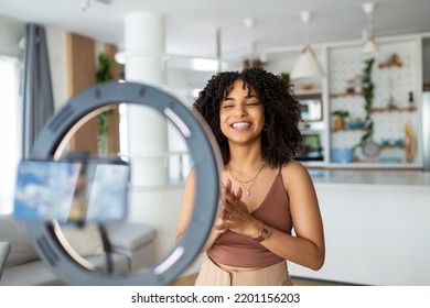 Young Female Influencer Using Her Smart Phone For Filming A Vlog Post.