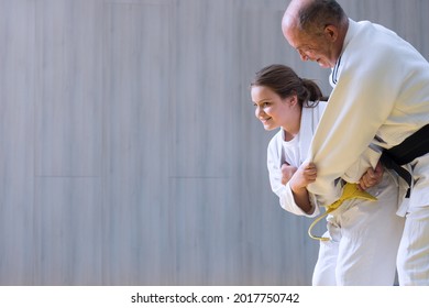 Young Female Judo Girl Practicing With Old Judo Teacher