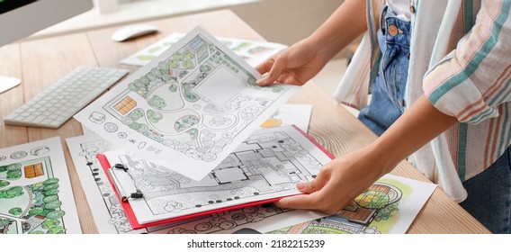 Young Female Landscape Designer Working In Office, Closeup