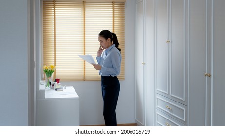 Young Female Leader, Asia People Lady Or Mba Student Standing Look In Front Of Mirror Fear Tired Pep Talk For Sale Pitch Hold Paper Document Script Public Speak Skill For Job Career Lost Self Improve.