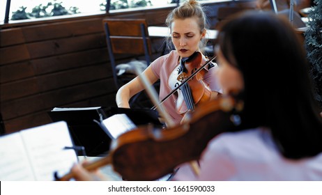 Young Female In Lilliac Summer Dress Playing Violin Outside Restaurant Terrace Classical Concert Or Wedding Ceremony