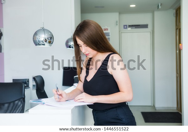 Young Female Manager Standing Reception Desk Stock Photo Edit Now