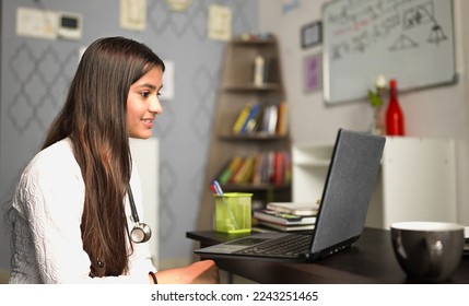 Young female medical assistant having online video calling distant patient on laptop at home. Doctor talking to client using virtual chat computer app suggesting better healthy lifestyle for cure