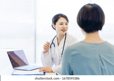 Young female medical doctor and patient in the hospital. Medical consultation.