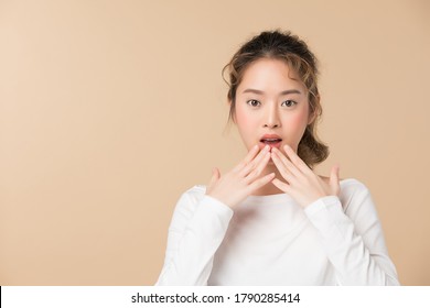 Young Female Model Posing Gesture. Isolated On Brown Color Background. 