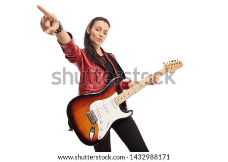 Young female musician with a bass electric guitar isolated on white background
