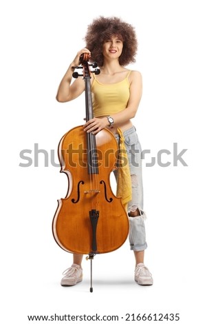 Young female musician standing with a contrabass and smiling isolated on white background
