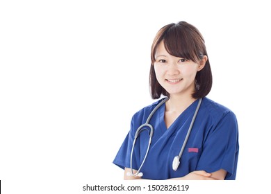 Young Female Nurse Wearing Scrubs Isolated On White Background