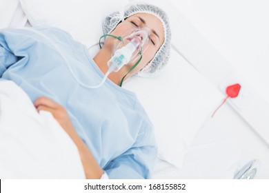 Young female patient receiving artificial ventilation in the hospital